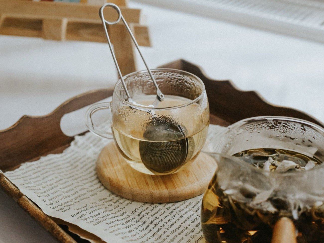 Cozy afternoon tea with glass teacups and infuser