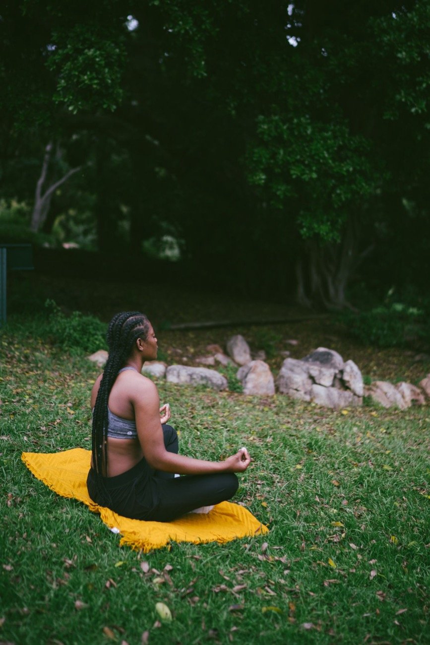 Woman meditating calmly at home