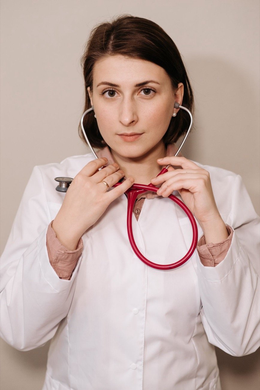 Physician in a white coat wearing a stethoscope